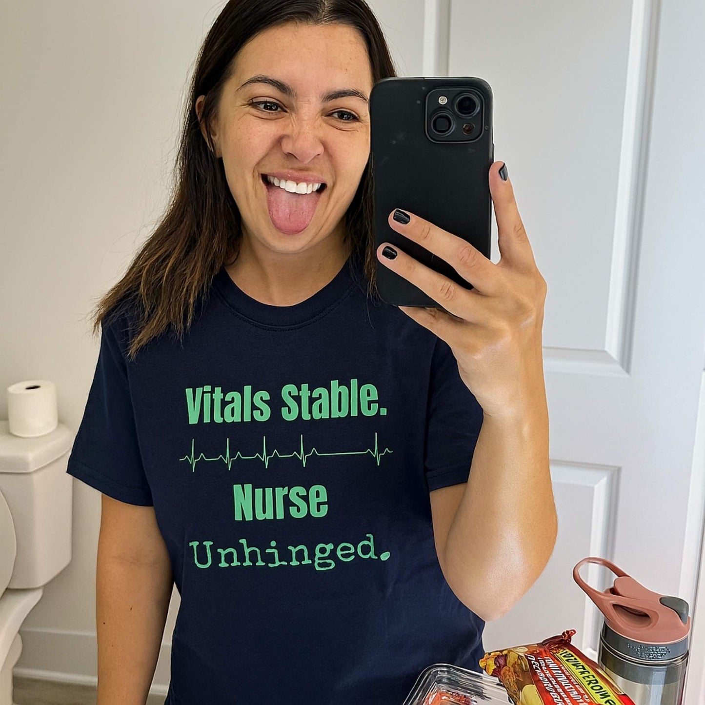 Funny ICU nurse gift — cotton nurse t-shirt reading "Vitals stable. Nurse: unhinged"